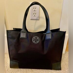 Tory Burch nylon collapsible tote with leather handles and trim. 15x 11.5x 6